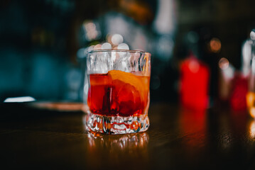 Cocktail Negroni with gin, campari martini rosso and orange. negroni cocktail at the bar