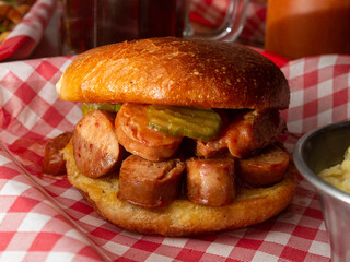 burger with sausage and fries