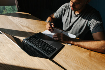 Entrepreneurs are working with a laptop and holding a document in a bit of office or at home.