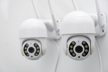 CCTV cameras on the wall record video all day to protect against thieves