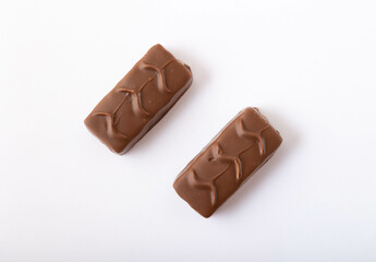 Chocolate bar on a white background top view.