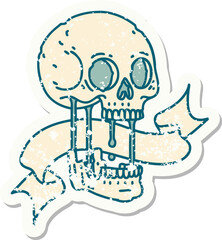 worn old sticker with banner of a skull