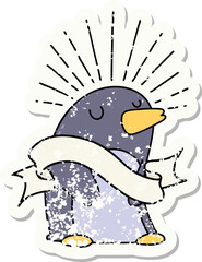 worn old sticker of a tattoo style happy penguin