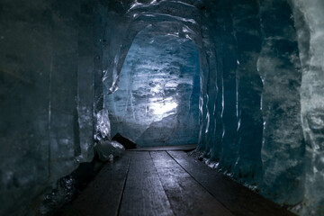 Ice cave inside the Rhone Glacier at Furka Pass in Switzerland. Summer photo.