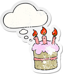 cartoon birthday cake with thought bubble as a distressed worn sticker