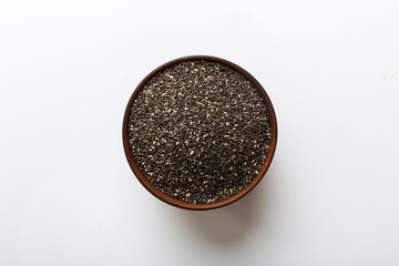 Chia seeds in bowl on colored background. Healthy Salvia hispanica in small bowl. Healthy superfood