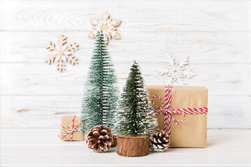Christmas composition. Gifts, small tree, branches and craft DIY decorations on white background. New year concept. Christmas home decoration Flat lay, top view, copy space