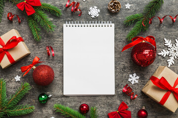 Christmas blank greeting card mock-up scene. Creative layout made of Christmas tree branches and...