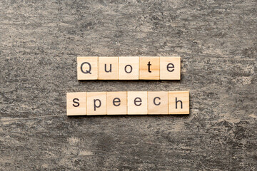 quote speech word written on wood block. quote speech text on cement table for your desing, concept