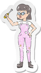 retro distressed sticker of a cartoon female mechanic