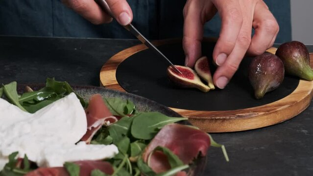 women's hands make fresh salad