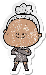distressed sticker of a cartoon happy old woman