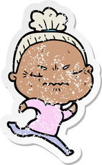 distressed sticker of a cartoon annoyed old lady