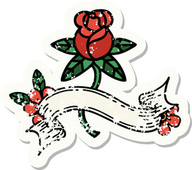 worn old sticker with banner of rose