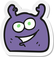 sticker of a cartoon little alien