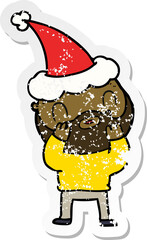 hand drawn distressed sticker cartoon of a bearded man wearing santa hat