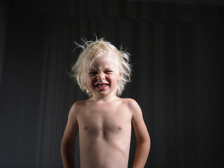 portrait child blonde hair emotional boy 