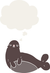 cartoon seal with thought bubble in retro style