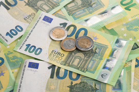 Pile of 100 euro banknotes close-up. European cash money banknotes. High quality photo