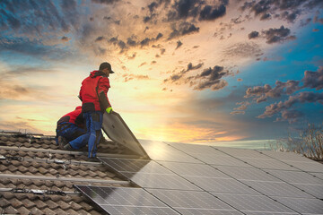 Installing solar photovoltaic panel system. Solar panel technician installing solar panels on roof....