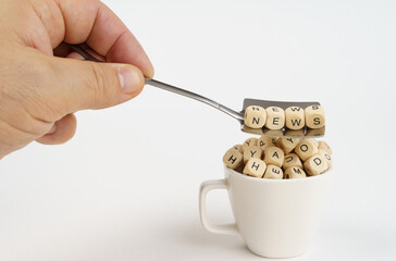 In a cup there are cubes with letters, on a spoon there are cubes with an inscription - News