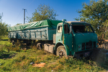 War in Ukraine. 2022 russian invasion of Ukraine. Countryside. Damaged truck after shelling. Terror of the civilian population. War crime