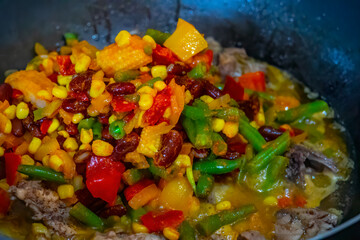 Tasty grilled vegetables on pan on dark background
