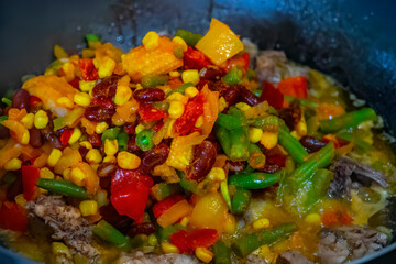 Tasty grilled vegetables on pan on dark background