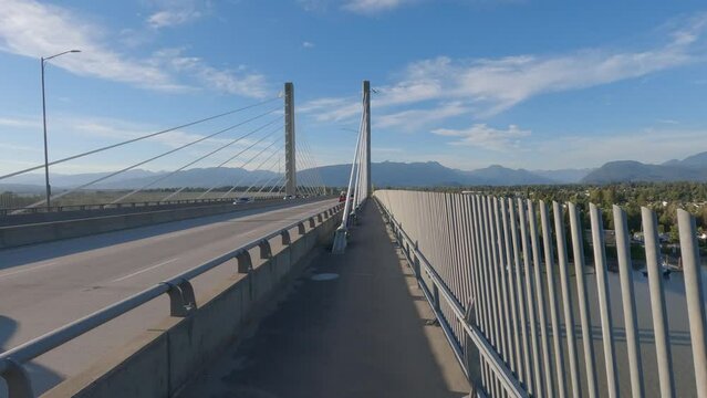 Pedestrian and Bicycle Path on Golden Ears Bridge over the Fraser River. Pitt Meadows, Langley, Greater Vancouver, British Columbia, Canada. High quality 4k footage