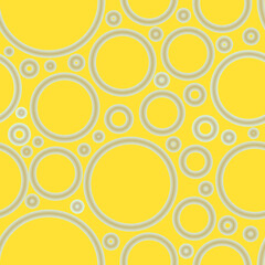 Fototapeta premium Geometric abstract seamless pattern of random arranged azure rings with dots texture on yellow background.Round shapes halftone point wallpaper.For stationery covers,trendy textile,fashionable fabrics