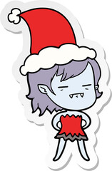 hand drawn sticker cartoon of a undead vampire girl wearing santa hat
