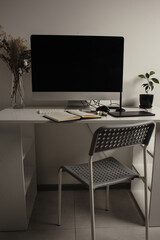 Fototapeta premium Comfortable place of work. Close-up top view of comfortable working place in office with and laptop. Workplace of designer. Notebook on the table. Business diary. Work at home. Place for making art.
