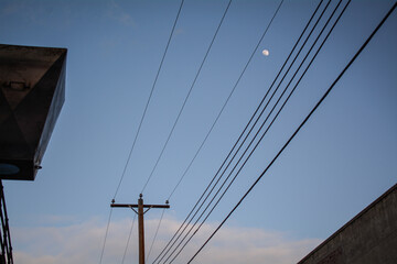 Sky view with powerline and the moon