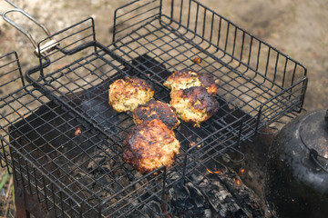 Cooking shish kebab on the grill. Cooking marinated meat on coals. Cooking meat on coals.