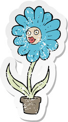 retro distressed sticker of a cartoon flower