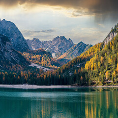 Fototapeta premium Autumn peaceful alpine lake Braies or Pragser Wildsee. Fanes-Sennes-Prags national park, South Tyrol, Dolomites Alps, Italy, Europe. Picturesque traveling, seasonal and nature beauty concept scene.