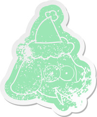 quirky cartoon distressed sticker of a elephant face wearing santa hat