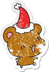 hand drawn christmas distressed sticker cartoon of kawaii bear