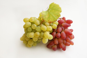 bunch of grapes. a bunch of red grapes and a bunch of green grapes on a white background