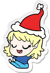 happy hand drawn sticker cartoon of a elf girl sitting wearing santa hat