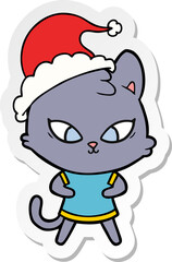 cute hand drawn sticker cartoon of a cat wearing santa hat