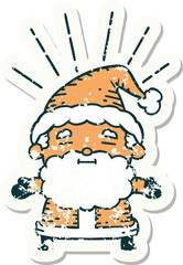 worn old sticker of a tattoo style santa claus christmas character