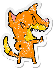 distressed sticker of a laughing fox cartoon