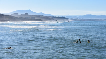Biarritz, France - 15 Jan, 2022: Surfers on the Cote des Basques beach