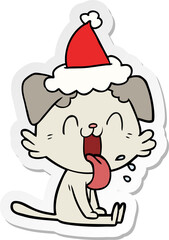 hand drawn sticker cartoon of a panting dog wearing santa hat
