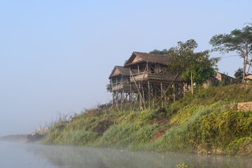 Straw house along river