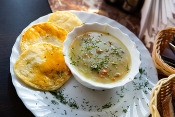 National dish of Belarus - thick gravy with meat, mushrooms, vegetable (mochanka) garnished with...