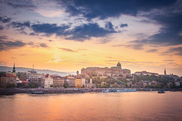 Danube River view of the Buda Castle at dramatic sunset, Budapest, Hungary