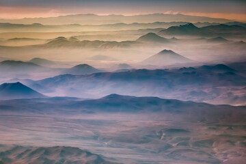 Aerial Atacama desert, snowcapped volcanoes and arid landscape in Chile