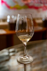 Wine tasting in underground cellars caves of French wine domain in Puligny-Motrachet village, Burgundy, France